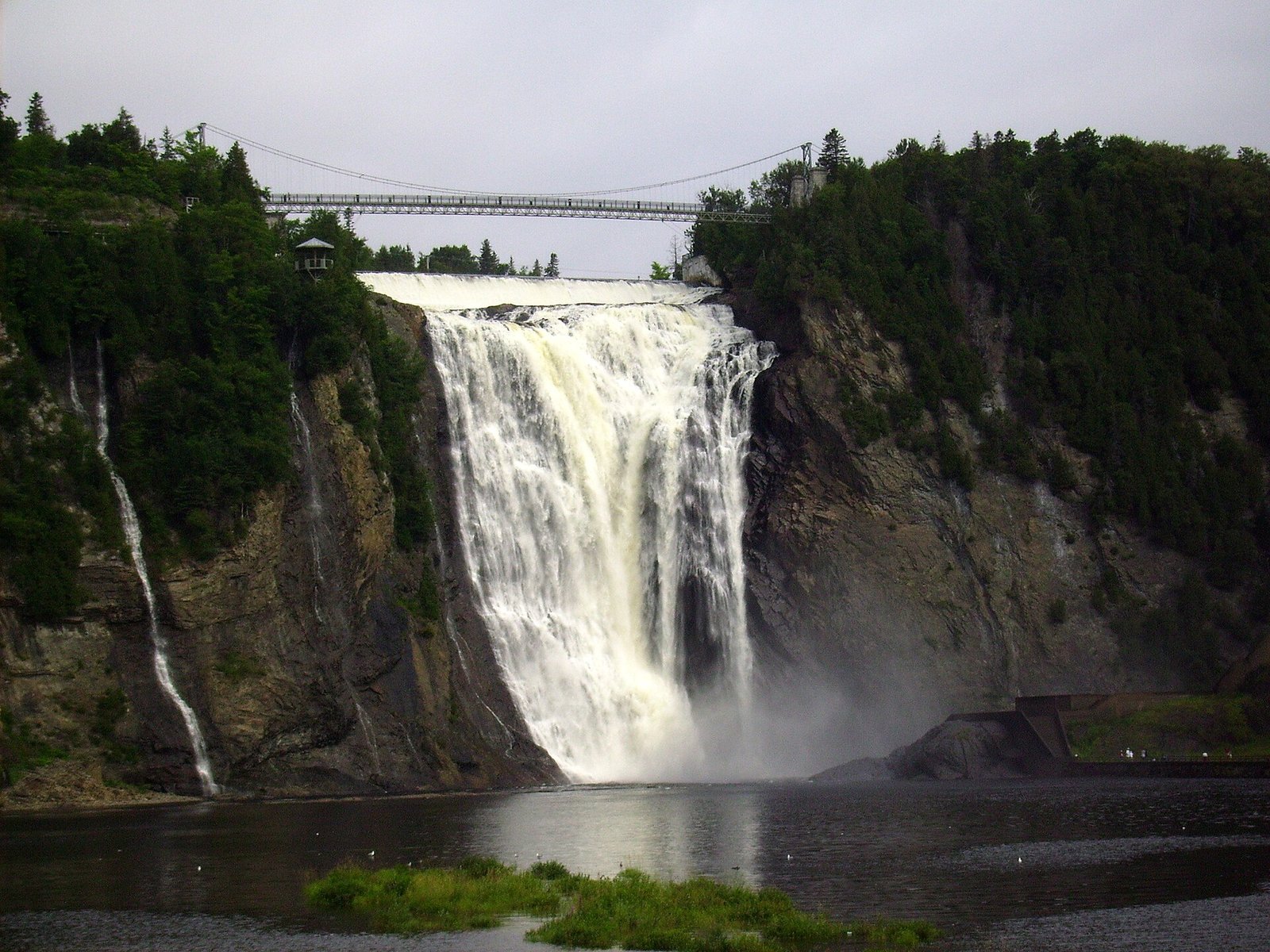 Montmorency Falls with its suspension bridge, taller than Niagara Falls