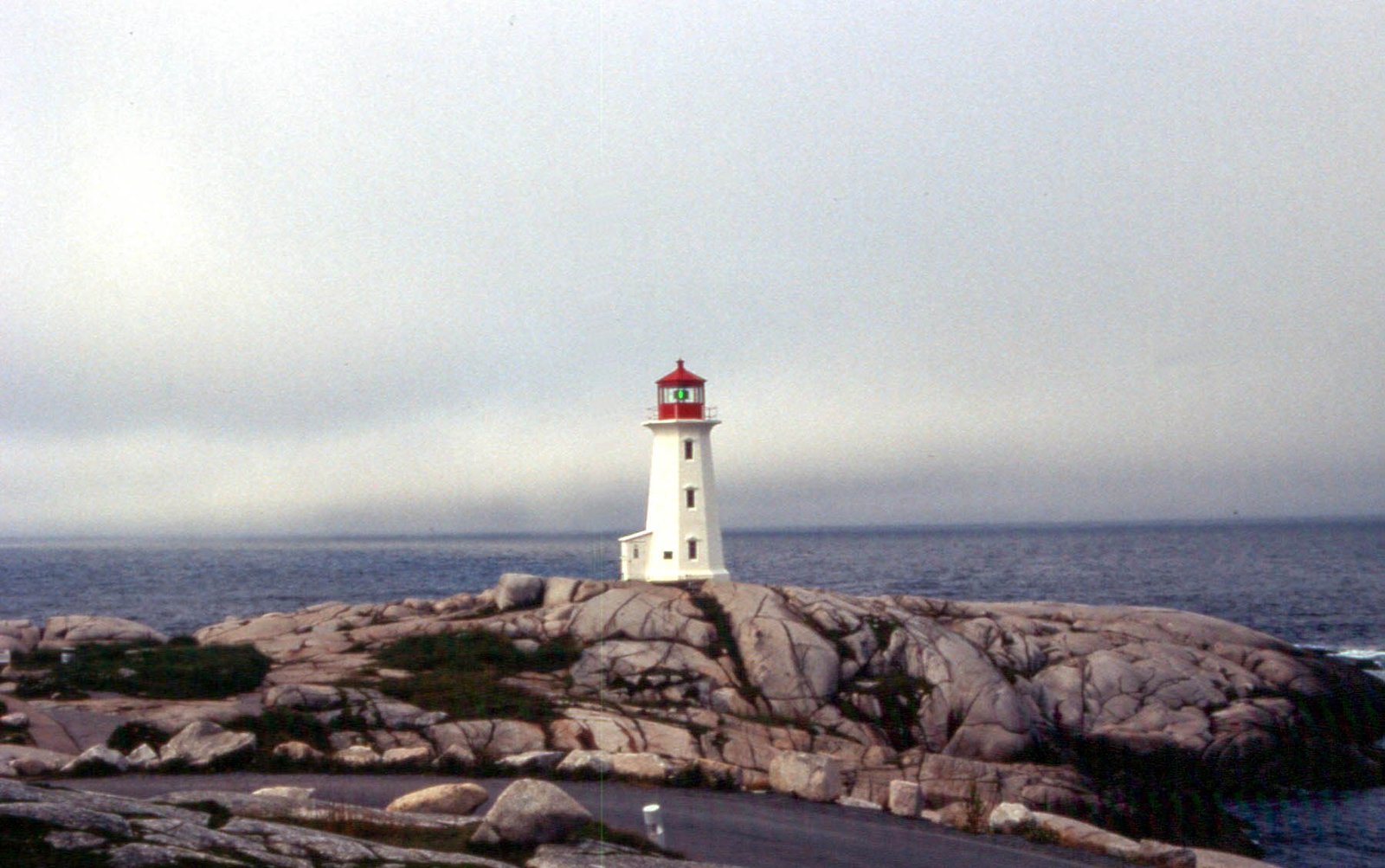 Peggy's Cove lighthouse seen from across the rocky cove