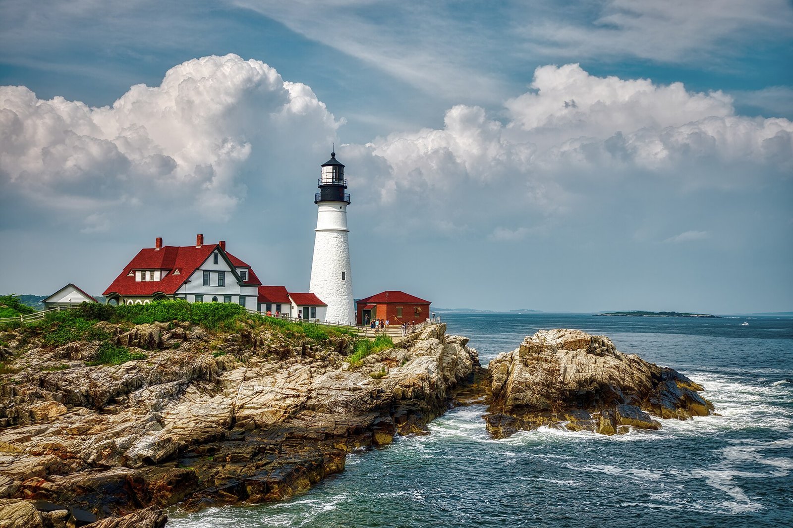 Portland Head Light on a rocky point with the keeper's house